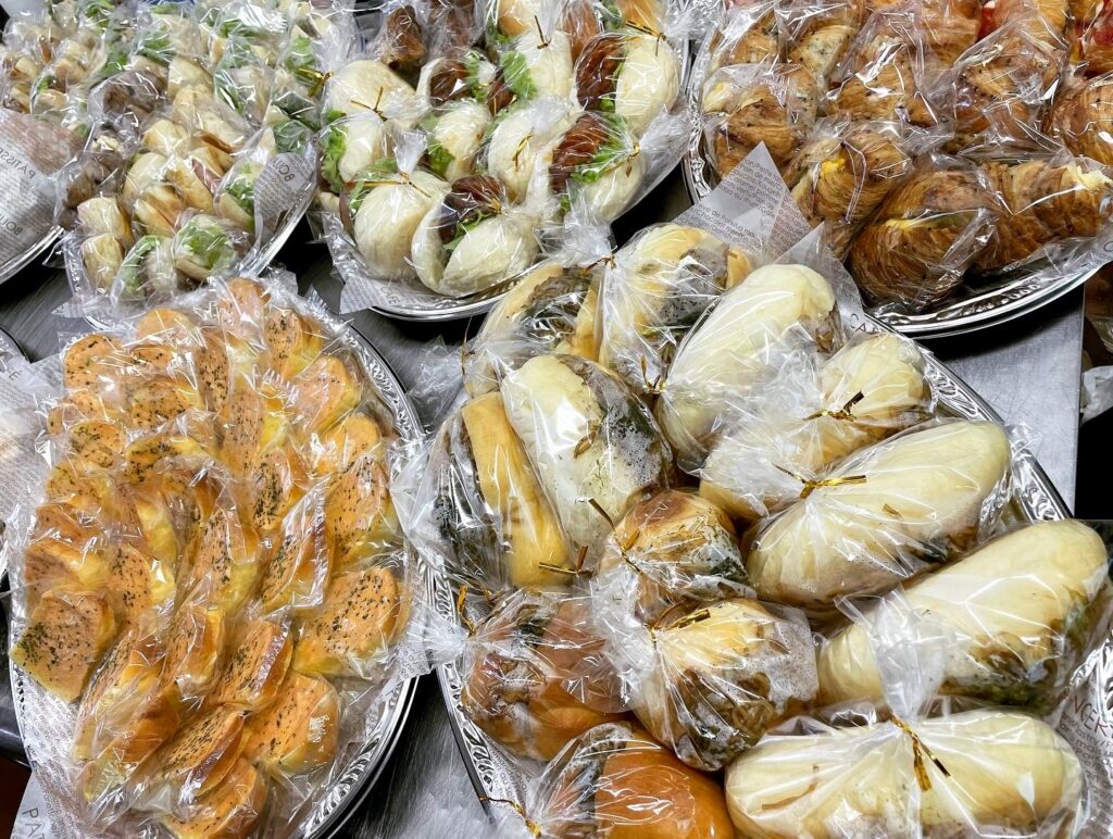 Platter of individually wrapped sweet and savory breads