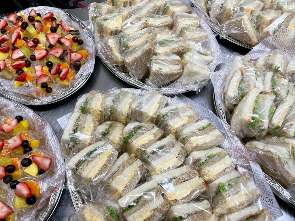 Wrapped sandwich platter and cup fruit